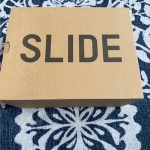 Adidas Tan Slide Box with Black Lettering
